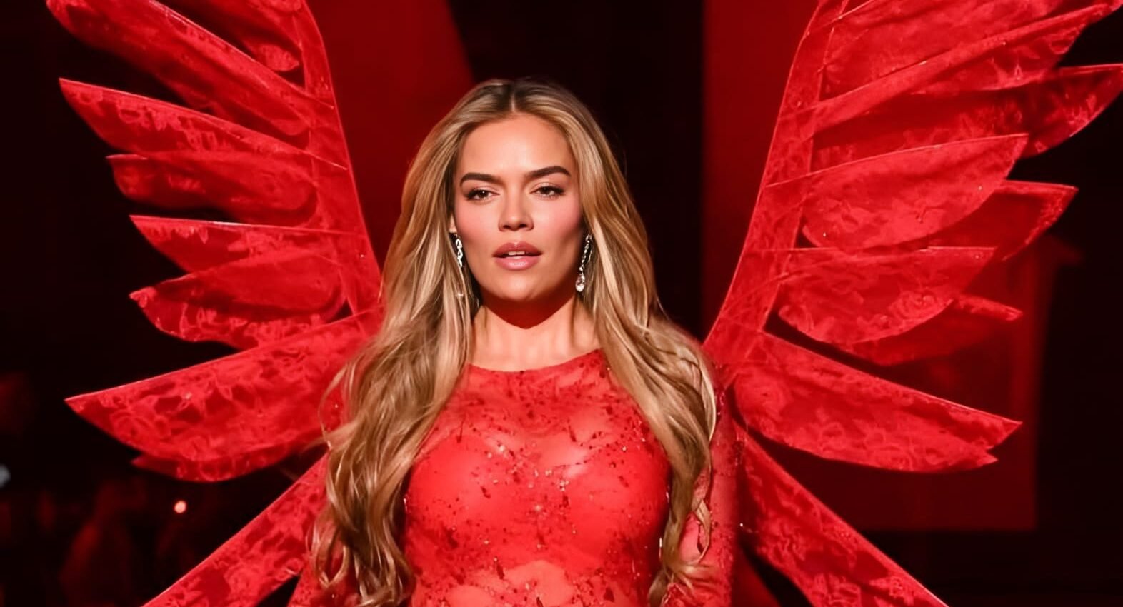 Karol G smiling on the Victoria’s Secret runway during her historic performance.